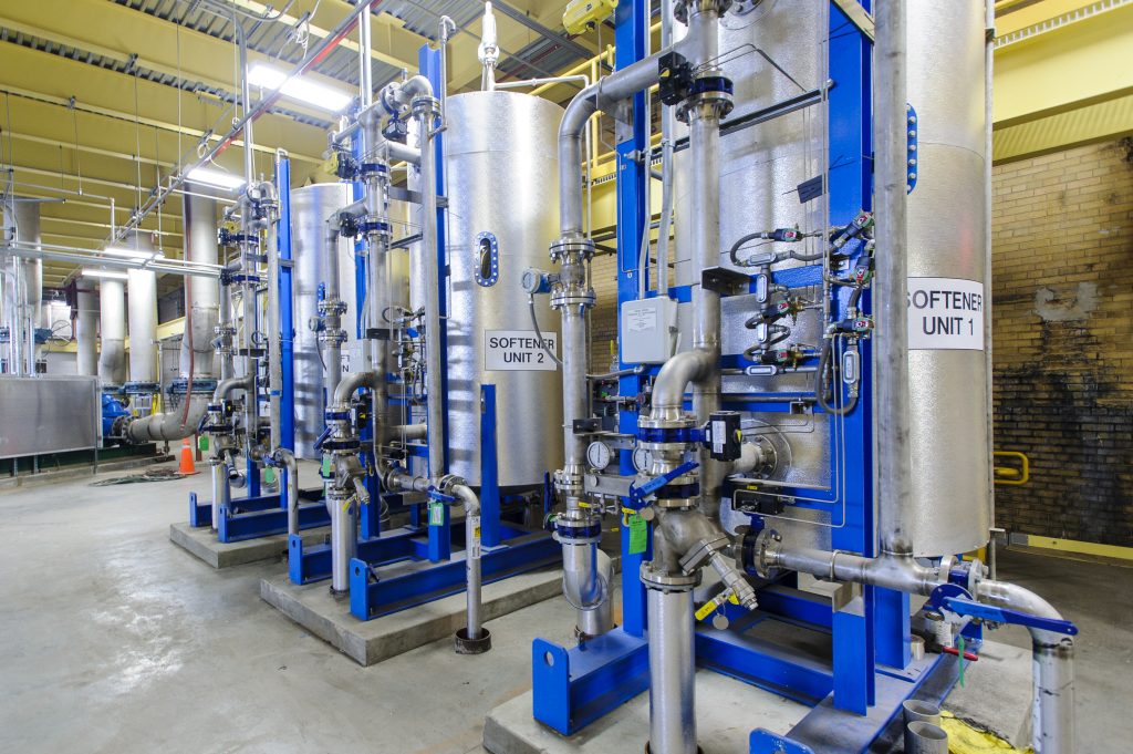 Indoor utility plumbing system made up of water tanks and pipes.