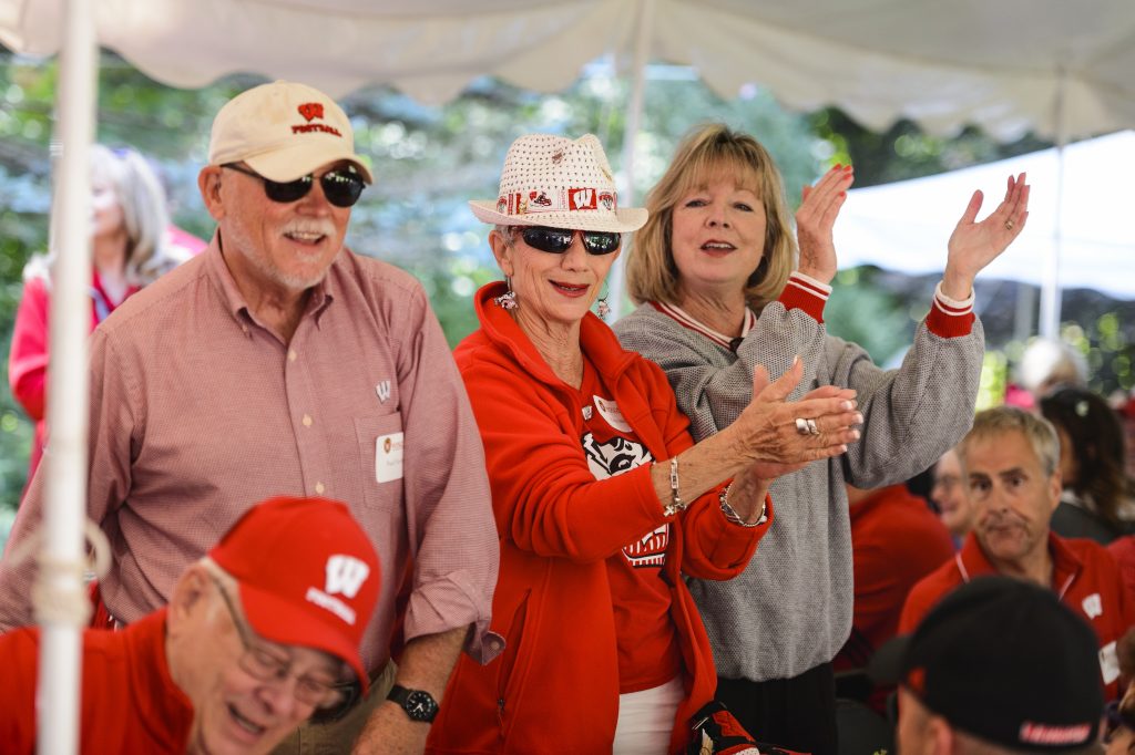 University of Wisconsin-Madison community members celebrating in badger spirit wear.