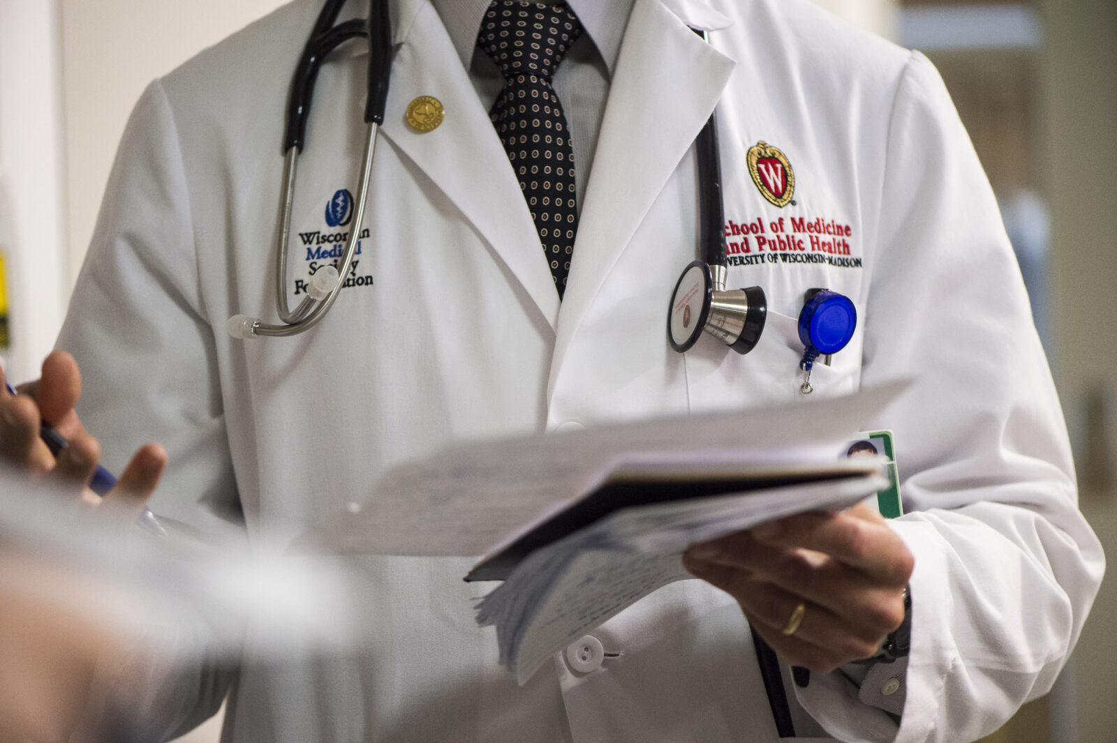 Doctor wearing a white coat.